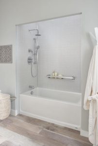 Remodeled shower/tub combo with silver hardware