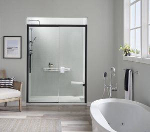 A modern bathroom with a walk-in shower, standalone bathtub, and furniture