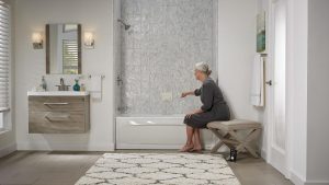 A woman prepares to enjoy a bath in a remodeled shower.